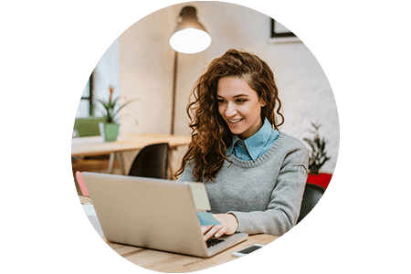 Woman using a laptop in an office setting