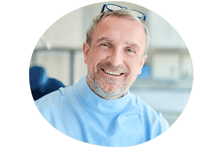 Private dentist smiling at the camera